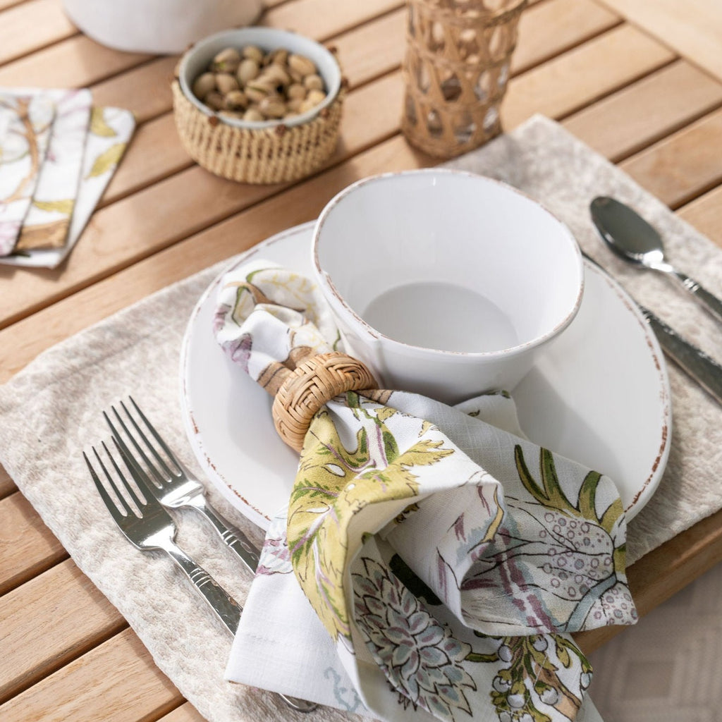 Reign Taupe Placemat Displayed with Terra Violet Dinner Napkin on Outdoor Table