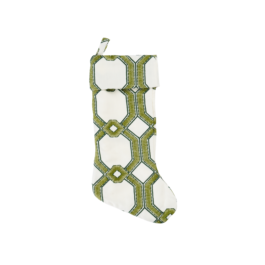 Decorative stocking with green geometric pattern on a white background