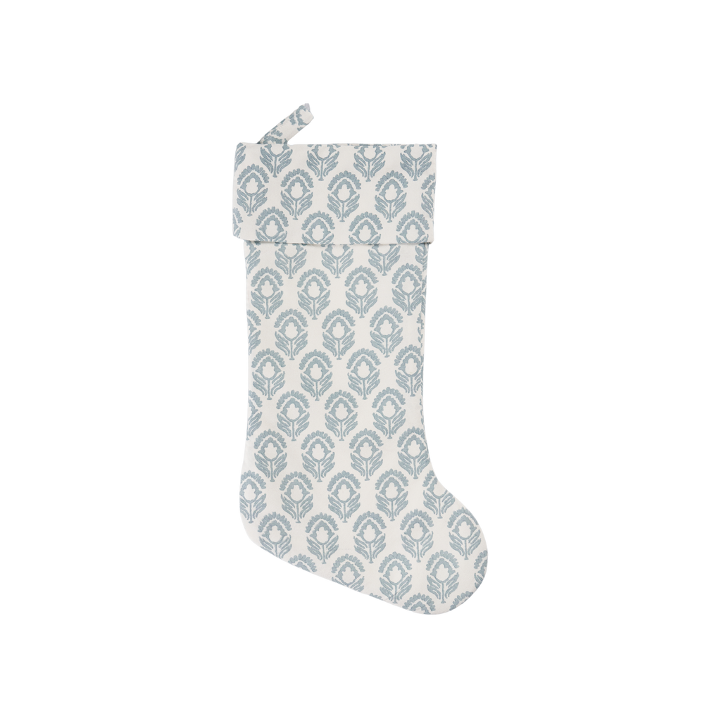 Decorative Christmas stocking with blue geometric pattern on a white background